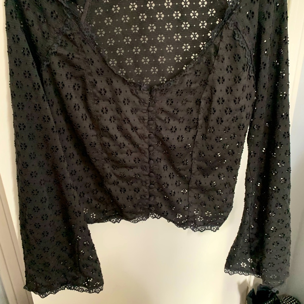 FREE PEOPLE black bell sleeve top. Size S
